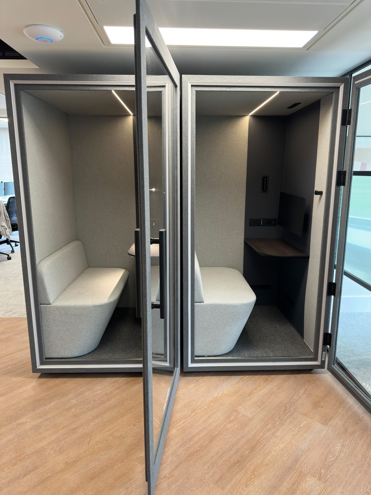 Twin Tuesday meeting pods with integrated AV — pod installation London